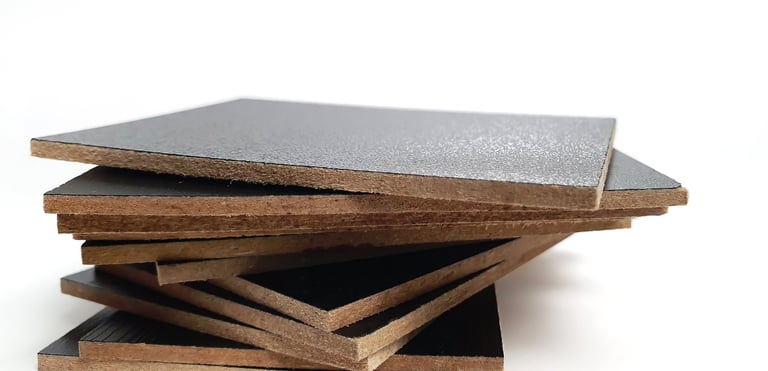 Close up stack of black melamine samples showing wooden edge isolated on white paper background with clipping path. melamine panels, MDF wooden board, samples.