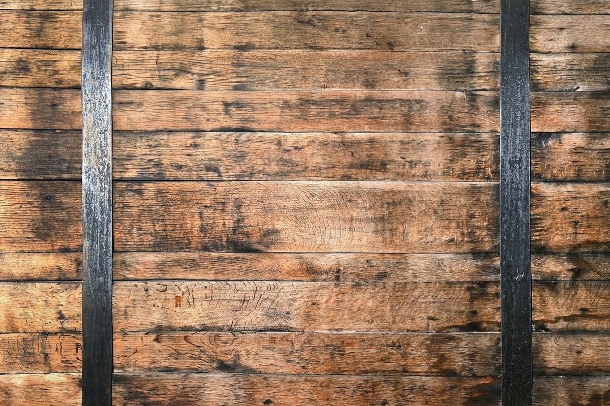 Rustic wooden planks with black metal iron stripes for vintage background