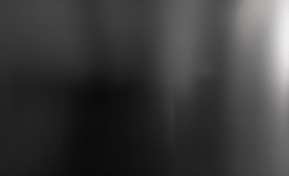 Motion blur stainless steel texture. Abstract dark gray polished metal background and white reflection